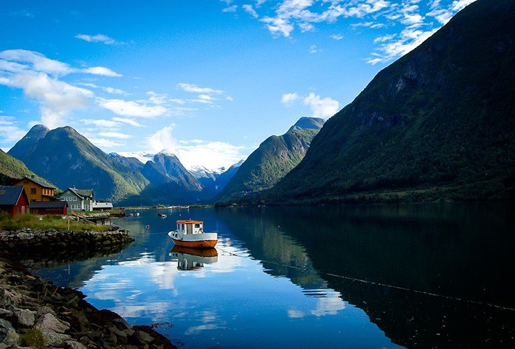 Ferry on water between fjords