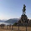 Statue in front of mountain