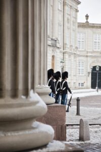 Queen's guard standing outside Amalienborg Castle in Copenhagen.