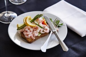 The famous Danish open faced sandwich called "Smoerrebroed" is a popular dish in New Nordic Cuisine.